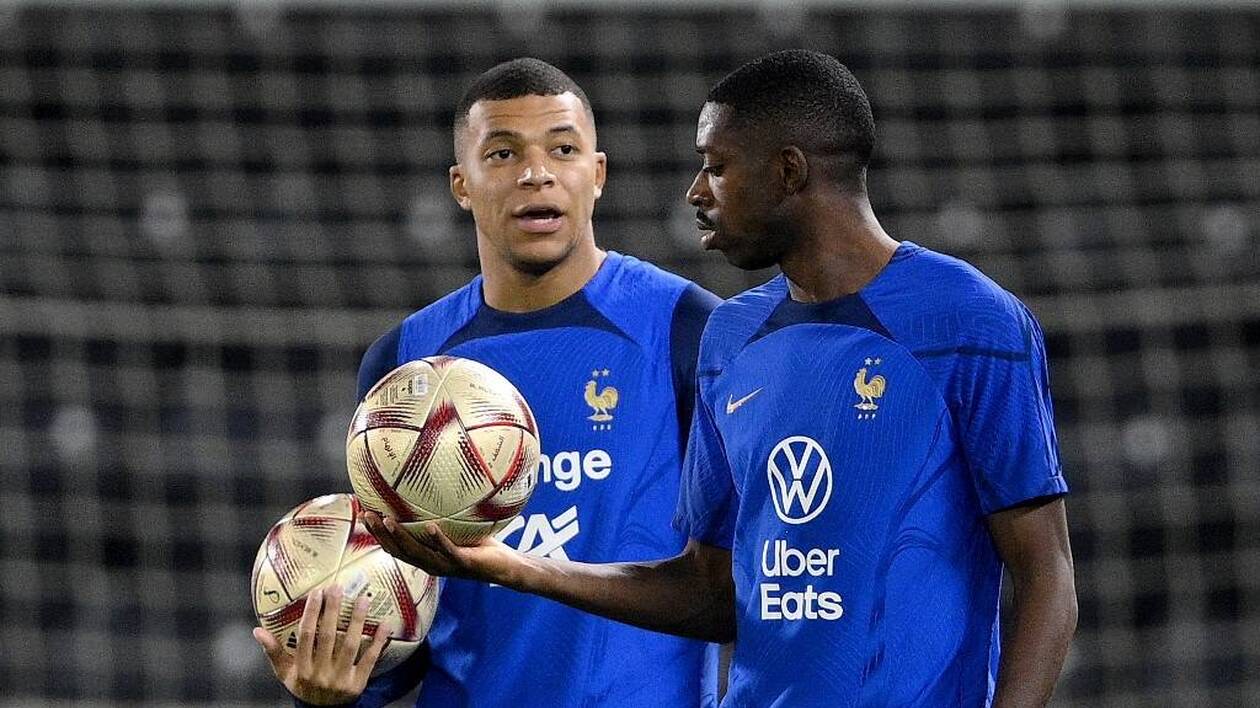 France's forward Kylian Mbappe (L) and France's forward Ousmane Dembele take part in a training session at the Jassim-bin-Hamad Stadium in Doha on December 12, 2022, in the build-up to the Qatar 2022 World Cup semi final football match between France and Morocco. (Photo by FRANCK FIFE / AFP)